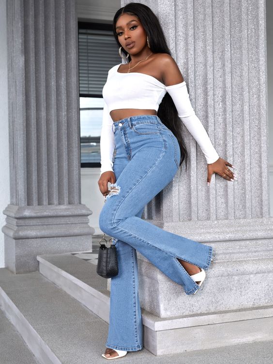 blue flared jeans and white open-toe heels